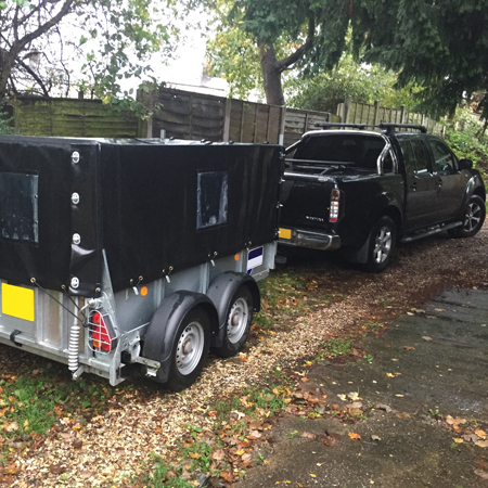 Image of our truck and trailer delivering materials through restricted rear access of properties