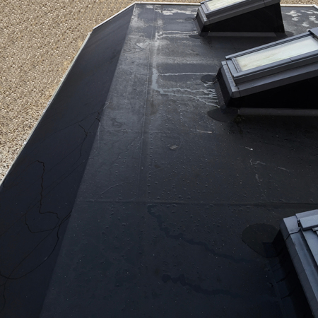 Image of Firestone EPDM rubber roof with Velux Windows and sloping canopy prepared for solar panels 