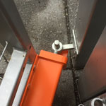 Top view industrial version Mk7 Left side anti lift fitted to a metal gate covering extended field gate hook on plate on a metal post gate in open position