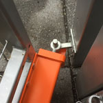 Top view industrial version Mk7 Left side anti lift fitted to a metal gate covering extended field gate hook on plate on a metal post gate in open position