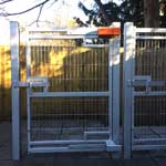 Mk7 left side ant lift and Mk7-T left side anti lift both fitted to a metal gate to demonstrate size comparison of the two versions